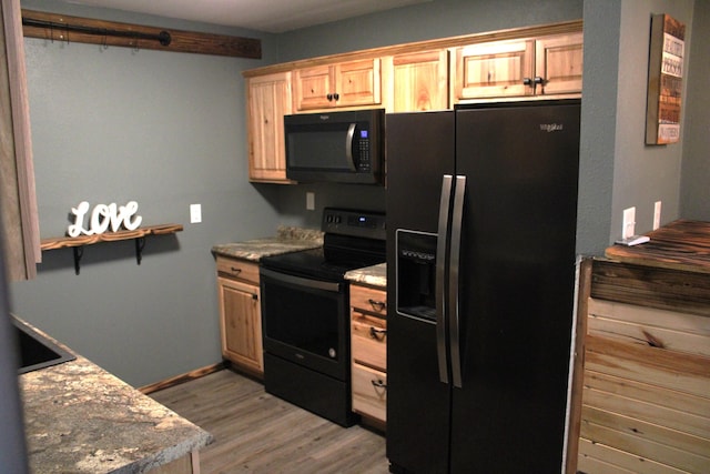 2240 Mease Dr, Reeds Spring, MO 65737 - kitchen featuring black appliances, light wood-type flooring, and light brown cabinetry