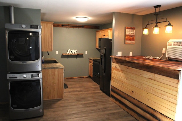 2240 Mease Dr, Reeds Spring, MO 65737 - kitchen featuring stacked washer / drying machine, dark wood-style floors, light brown cabinets, range, and black fridge with ice dispenser