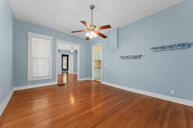 1201 N Broadway Ave, Springfield, MO 65802 - spare room featuring a ceiling fan and wood finished floors