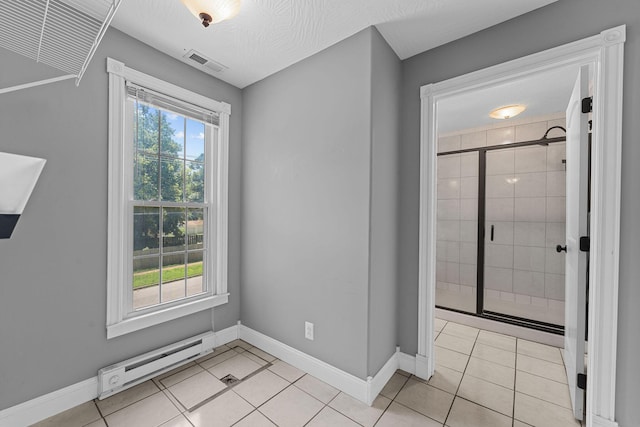 1201 N Broadway Ave, Springfield, MO 65802 - unfurnished room with baseboard heating and light tile patterned floors