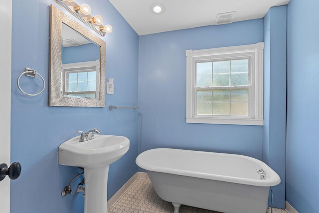 1201 N Broadway Ave, Springfield, MO 65802 - bathroom with a freestanding bath and tile patterned floors