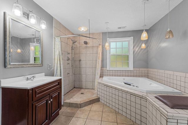 1201 N Broadway Ave, Springfield, MO 65802 - full bathroom featuring a garden tub, a shower stall, tile patterned flooring, and vanity