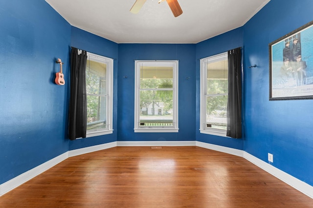 1201 N Broadway Ave, Springfield, MO 65802 - unfurnished room with wood finished floors and a ceiling fan
