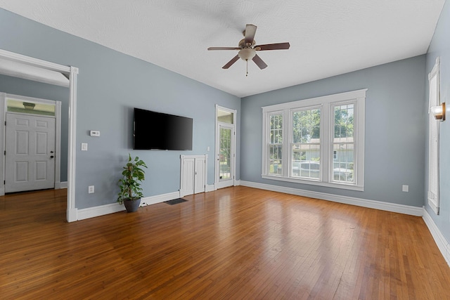 1201 N Broadway Ave, Springfield, MO 65802 - unfurnished living room featuring a ceiling fan and hardwood / wood-style floors
