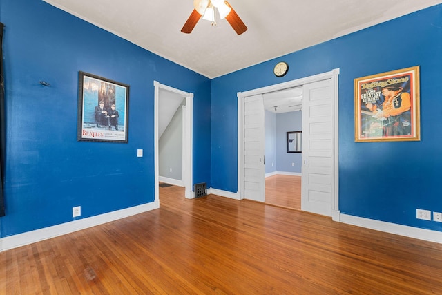 1201 N Broadway Ave, Springfield, MO 65802 - spare room with a ceiling fan and wood finished floors