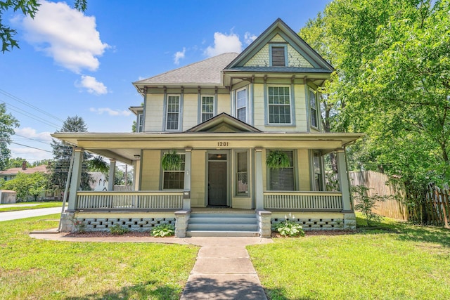 1201 N Broadway Ave, Springfield, MO 65802 - victorian home with covered porch and a shingled roof