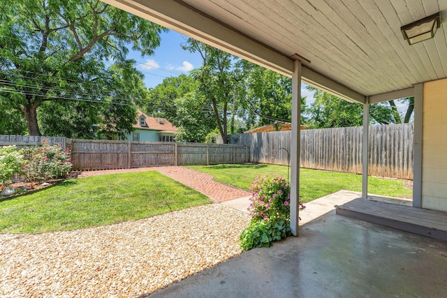 1201 N Broadway Ave, Springfield, MO 65802 - fenced backyard with a patio area