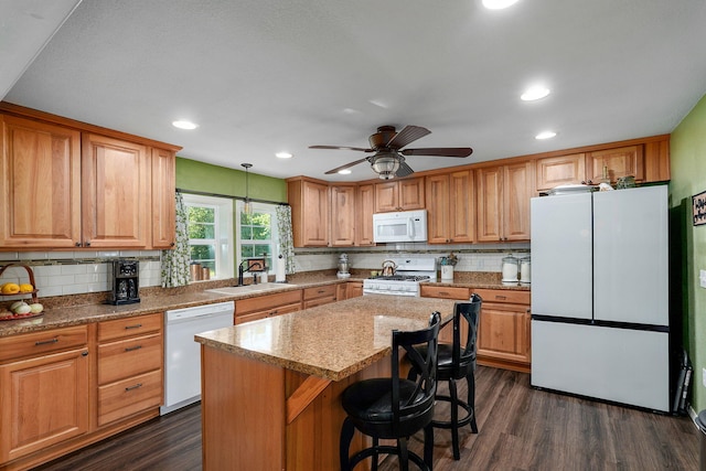 12655 Lawrence Unit 2155, Mount Vernon, MO 65712 - kitchen featuring white appliances, tasteful backsplash, dark wood-style floors, a kitchen island, and a ceiling fan