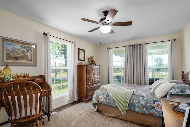 12655 Lawrence Unit 2155, Mount Vernon, MO 65712 - bedroom featuring multiple windows, wood finished floors, and a ceiling fan