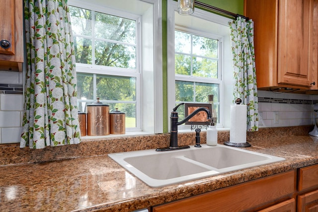 12655 Lawrence Unit 2155, Mount Vernon, MO 65712 - kitchen with tasteful backsplash and brown cabinetry