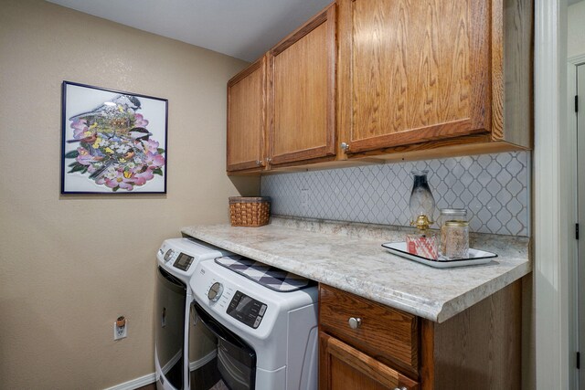 12655 Lawrence Unit 2155, Mount Vernon, MO 65712 - laundry room with cabinet space and washer and clothes dryer