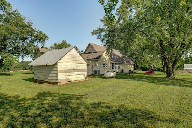 12655 Lawrence Unit 2155, Mount Vernon, MO 65712 - view of home's exterior with a yard and a storage unit