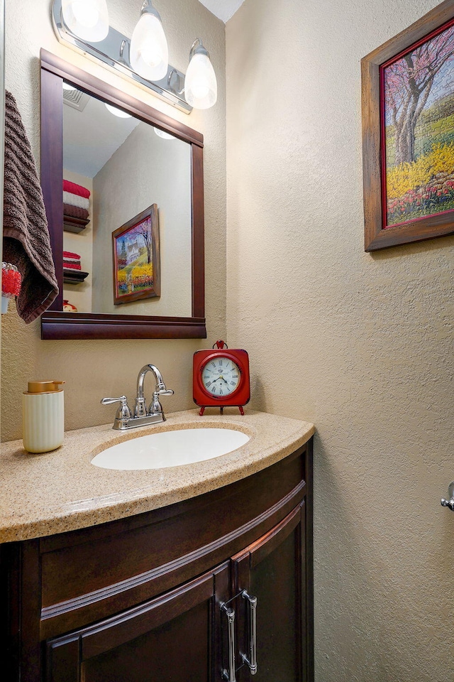 12655 Lawrence Unit 2155, Mount Vernon, MO 65712 - bathroom featuring vanity and a textured wall