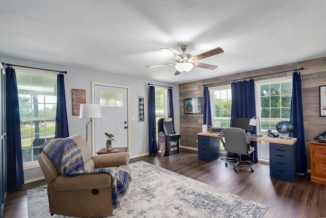 12655 Lawrence Unit 2155, Mount Vernon, MO 65712 - home office with plenty of natural light, dark wood-style flooring, ceiling fan, a textured ceiling, and wood walls