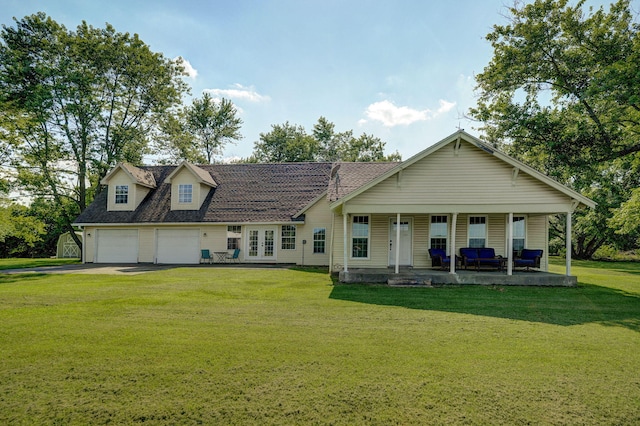 12655 Lawrence Unit 2155, Mount Vernon, MO 65712 - view of front facade featuring a garage, a front lawn, asphalt driveway, french doors, and covered porch