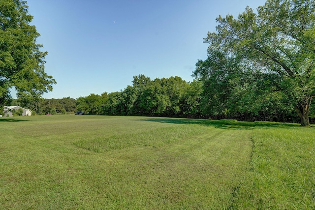 12655 Lawrence Unit 2155, Mount Vernon, MO 65712 - view of grassy yard with a view of trees