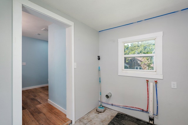 114 N Hobbs St, Miller, MO 65707 - laundry area with baseboards and light wood finished floors