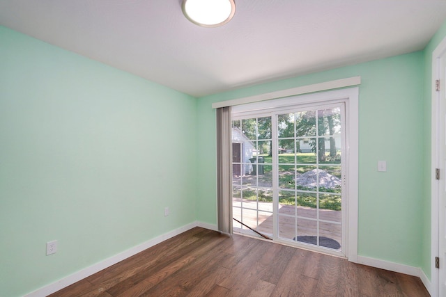 114 N Hobbs St, Miller, MO 65707 - empty room featuring dark wood-type flooring