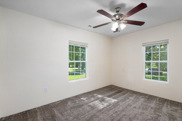 114 N Hobbs St, Miller, MO 65707 - carpeted empty room with ceiling fan
