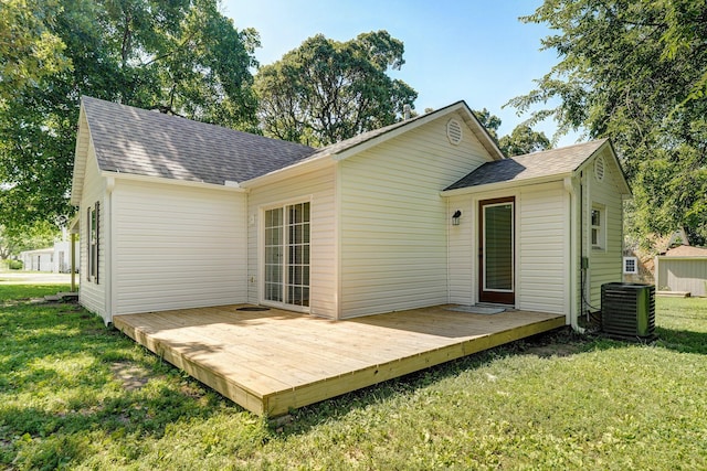 114 N Hobbs St, Miller, MO 65707 - back of property featuring a shingled roof, a deck, and a lawn