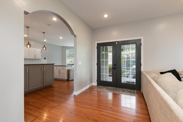295 Headwaters Dr, Marshfield, MO 65706 - foyer with arched walkways, french doors, wood finished floors, and recessed lighting