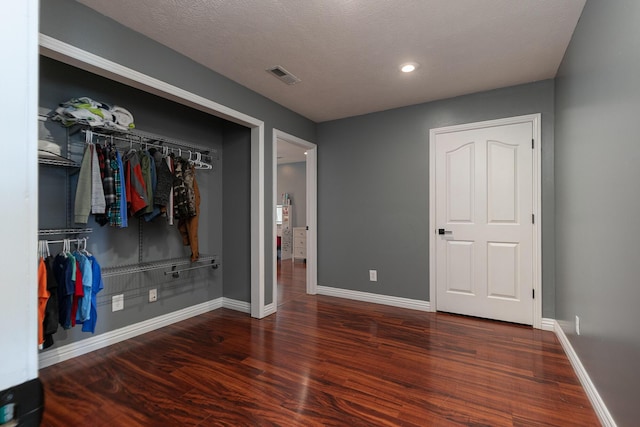 295 Headwaters Dr, Marshfield, MO 65706 - unfurnished bedroom with a closet, wood finished floors, and recessed lighting