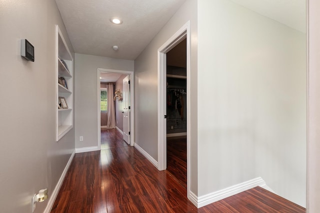 295 Headwaters Dr, Marshfield, MO 65706 - hallway featuring dark wood-style floors and baseboards