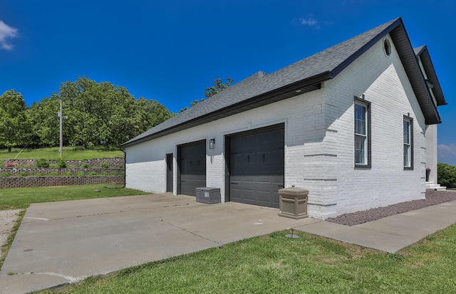 295 Headwaters Dr, Marshfield, MO 65706 - view of home's exterior featuring concrete driveway, brick siding, a shingled roof, an attached garage, and a lawn