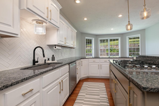 295 Headwaters Dr, Marshfield, MO 65706 - kitchen featuring appliances with stainless steel finishes, recessed lighting, dark wood-style floors, white cabinetry, and tasteful backsplash