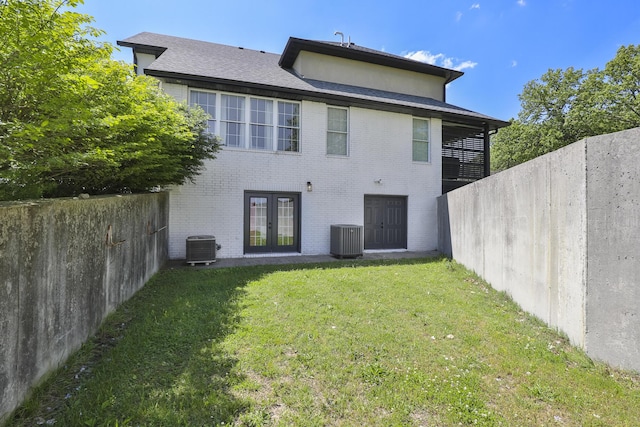295 Headwaters Dr, Marshfield, MO 65706 - back of property featuring french doors, brick siding, and a fenced backyard