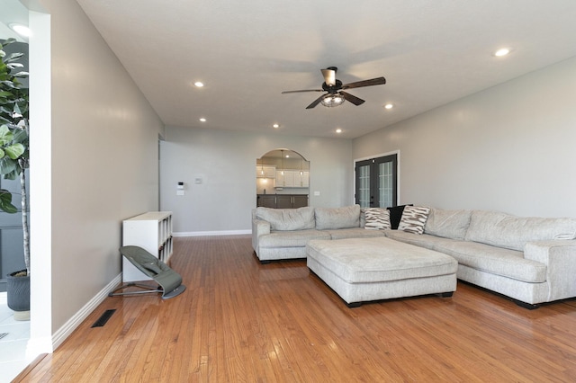 295 Headwaters Dr, Marshfield, MO 65706 - living area featuring hardwood / wood-style flooring, a ceiling fan, arched walkways, french doors, and recessed lighting