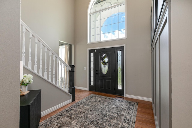 295 Headwaters Dr, Marshfield, MO 65706 - entrance foyer with plenty of natural light, wood finished floors, stairway, and a towering ceiling