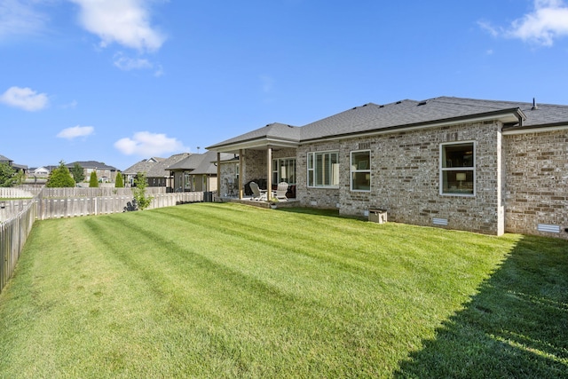 940 E Powers Ct, Nixa, MO 65714 - back of house featuring brick siding, a shingled roof, a patio, crawl space, and a residential view