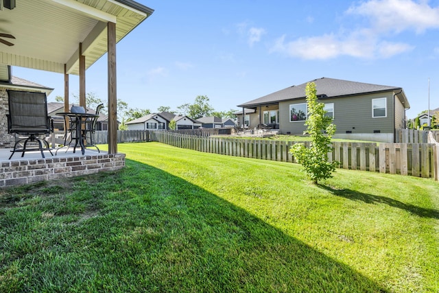 940 E Powers Ct, Nixa, MO 65714 - fenced backyard with a patio area, a residential view, and a ceiling fan