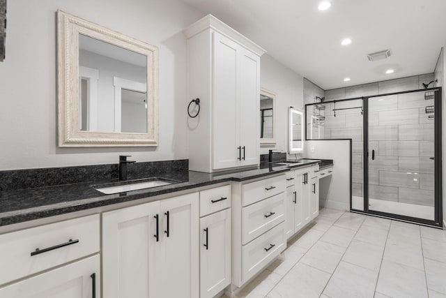 940 E Powers Ct, Nixa, MO 65714 - full bathroom featuring double vanity, a shower stall, and recessed lighting