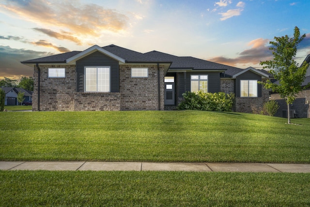 940 E Powers Ct, Nixa, MO 65714 - view of front facade with a front lawn and brick siding