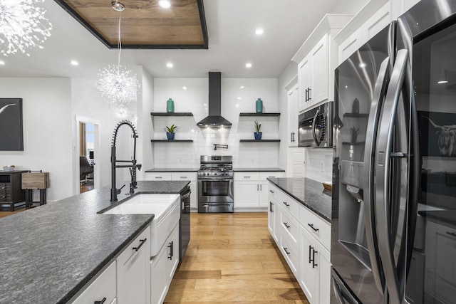 940 E Powers Ct, Nixa, MO 65714 - kitchen featuring appliances with stainless steel finishes, wall chimney range hood, open shelves, recessed lighting, and backsplash