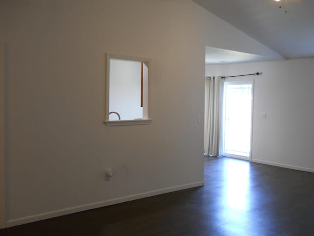 424 Echo Valley Cir, Reeds Spring, MO 65737 - spare room with lofted ceiling and baseboards