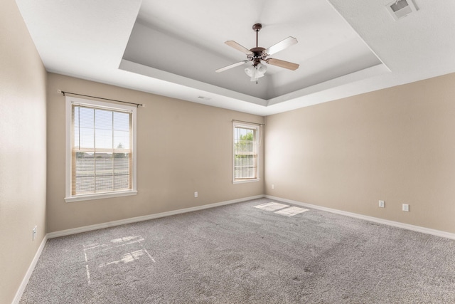 663 N Althea Ave, Nixa, MO 65714 - empty room with a raised ceiling, a ceiling fan, and carpet flooring