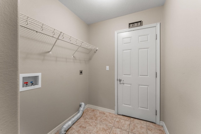 663 N Althea Ave, Nixa, MO 65714 - laundry area featuring electric dryer hookup, hookup for a washing machine, and light tile patterned flooring