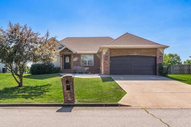 663 N Althea Ave, Nixa, MO 65714 - view of front of home featuring a garage, brick siding, concrete driveway, and roof with shingles