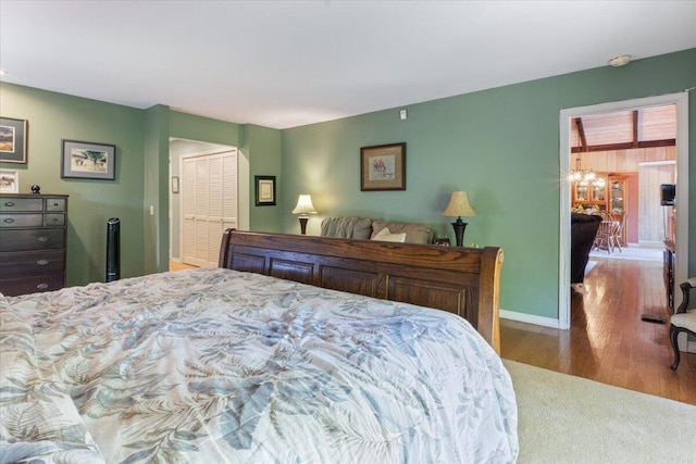 23 Sweetwater Ln, Buffalo, MO 65622 - carpeted bedroom with wood finished floors and baseboards