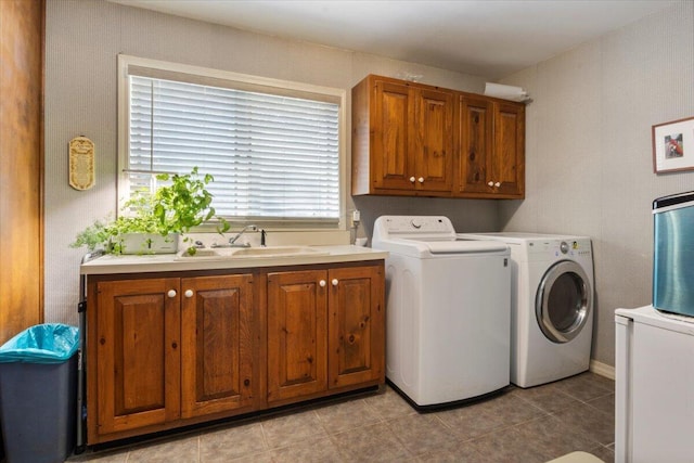 23 Sweetwater Ln, Buffalo, MO 65622 - laundry area featuring washer and clothes dryer, cabinet space, and light tile patterned floors