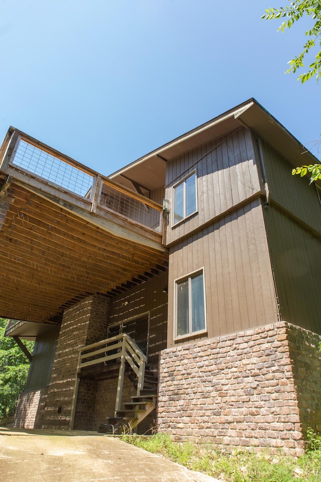 23 Sweetwater Ln, Buffalo, MO 65622 - back of house featuring a balcony, stairs, and stone siding