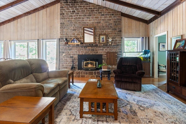 23 Sweetwater Ln, Buffalo, MO 65622 - living room featuring high vaulted ceiling, a wooden ceiling with exposed beams, wood walls, wood finished floors, and a fireplace