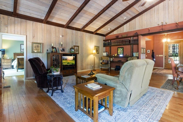 23 Sweetwater Ln, Buffalo, MO 65622 - living room featuring hardwood / wood-style floors, high vaulted ceiling, a wooden ceiling with exposed beams, a ceiling fan, and wood walls