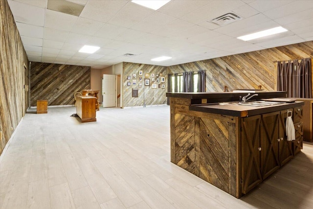 23 Sweetwater Ln, Buffalo, MO 65622 - bar featuring wooden walls, a drop ceiling, and light wood-style floors