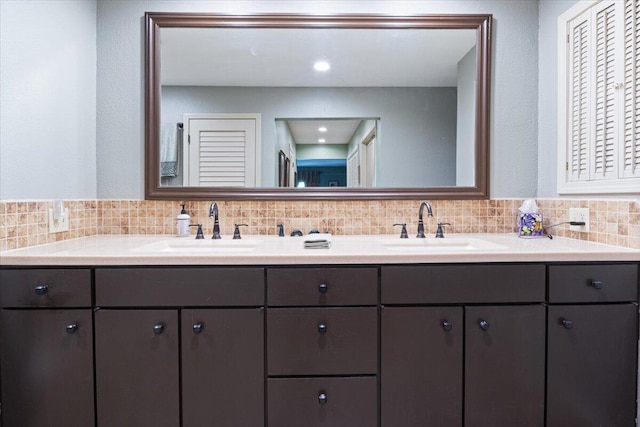 23 Sweetwater Ln, Buffalo, MO 65622 - full bathroom featuring double vanity and tasteful backsplash