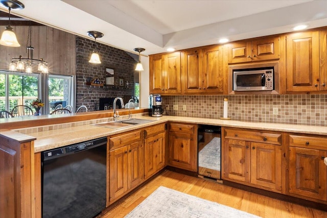 23 Sweetwater Ln, Buffalo, MO 65622 - kitchen featuring black dishwasher, stainless steel microwave, brown cabinetry, tasteful backsplash, and recessed lighting