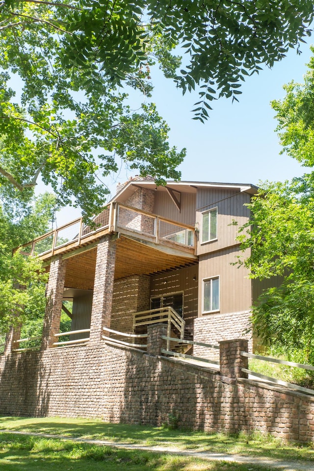 23 Sweetwater Ln, Buffalo, MO 65622 - view of front of house featuring a balcony and brick siding